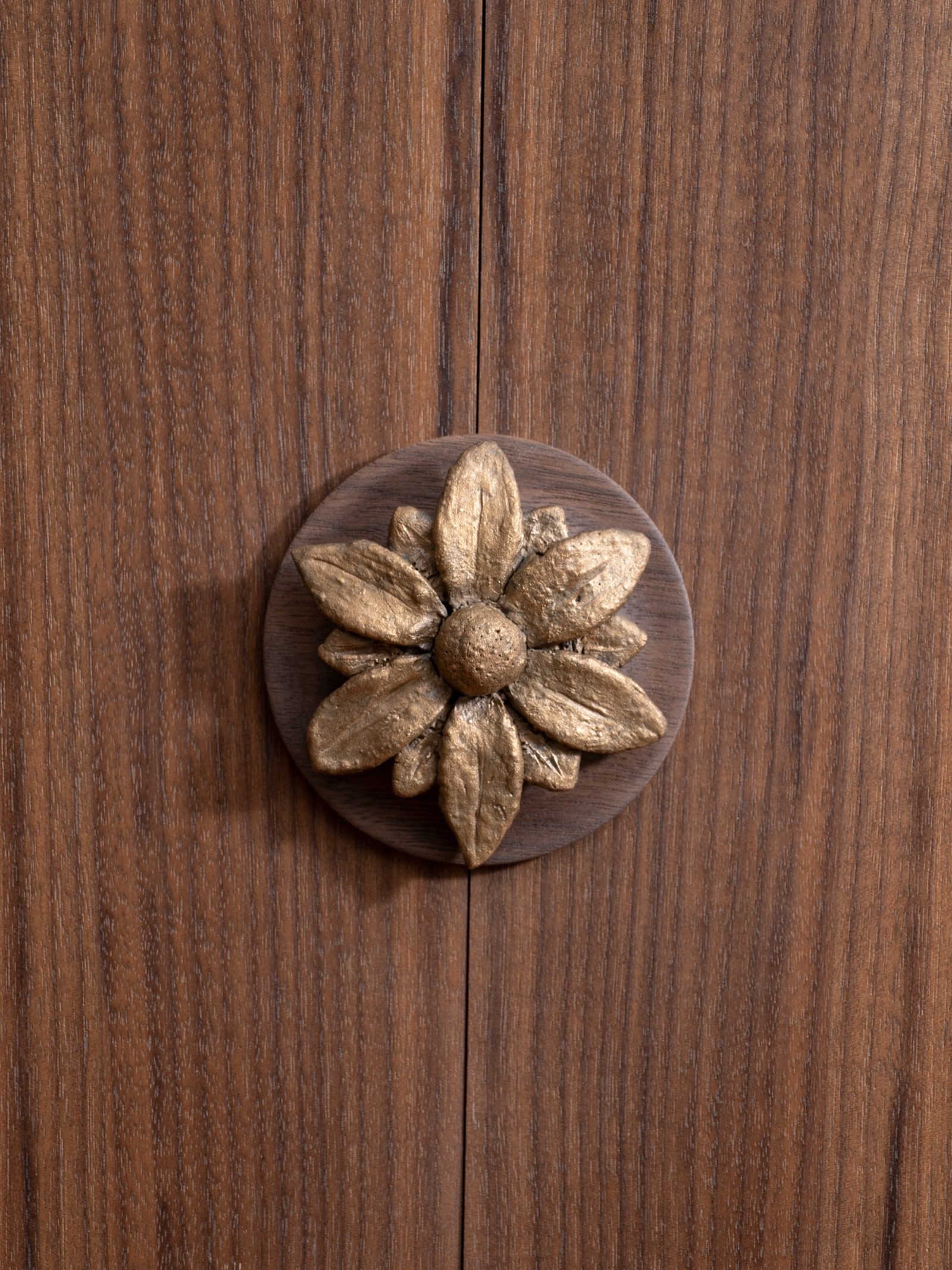 Hand-forged bronze flower detail