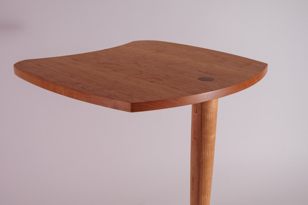 Movie Night — top detail showing figured cherry grain and walnut plug