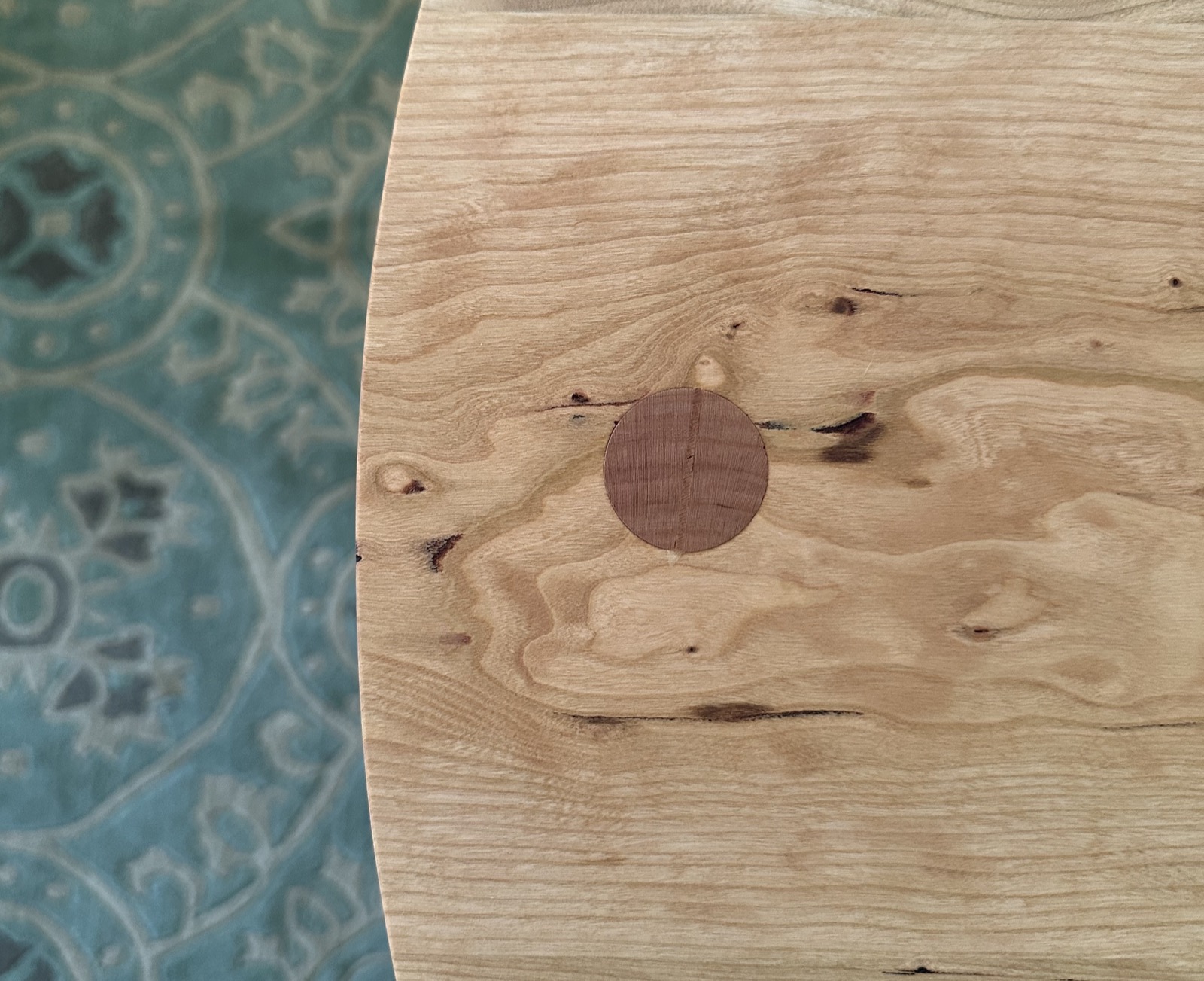 Movie Night — overhead view of figured cherry top with walnut plug